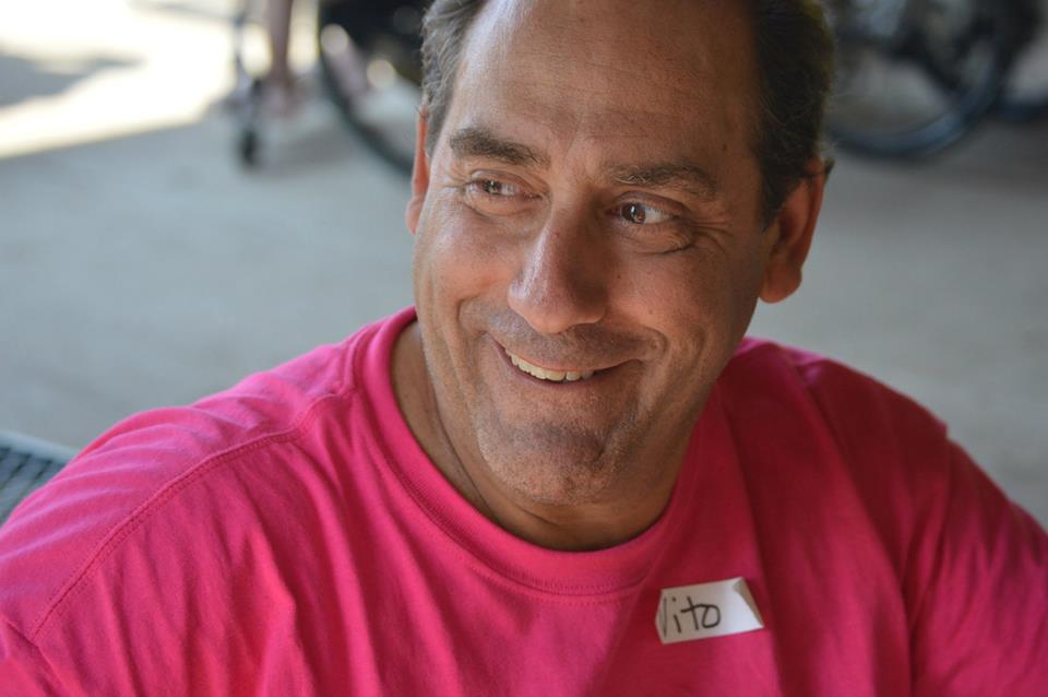 adult male volunteer smiling
